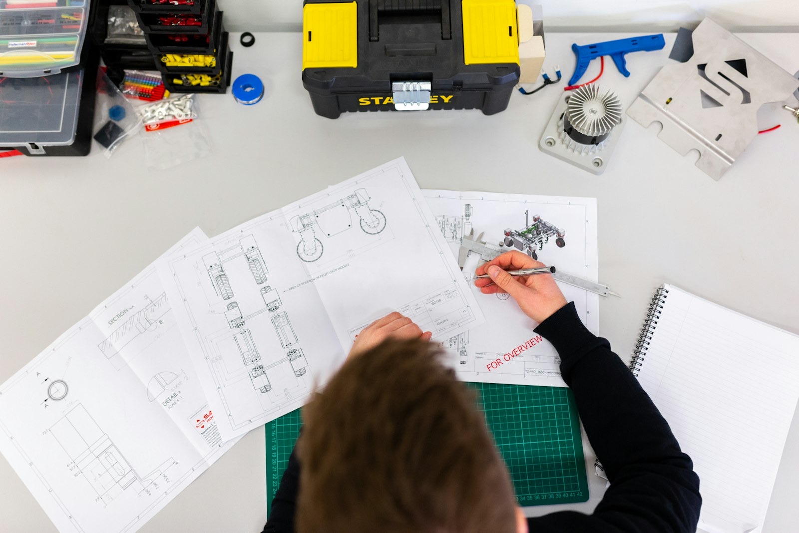 Engineer reviewing technical drawings while planning a GPR survey