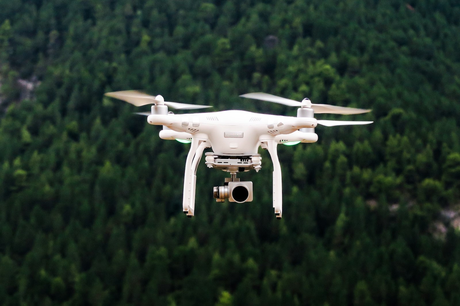A survey drone in flight, inspecting a building at height without scaffolding