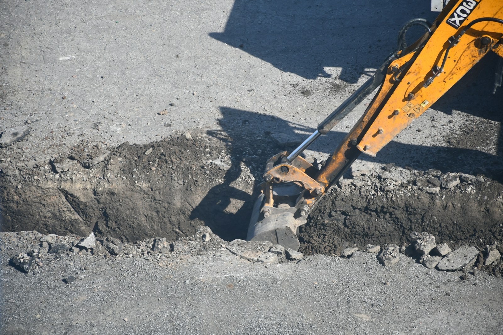 Excavation of a trench in a road